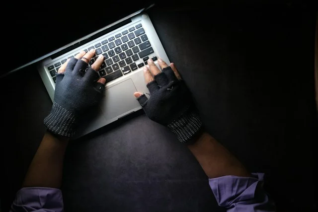 A man typing laptop